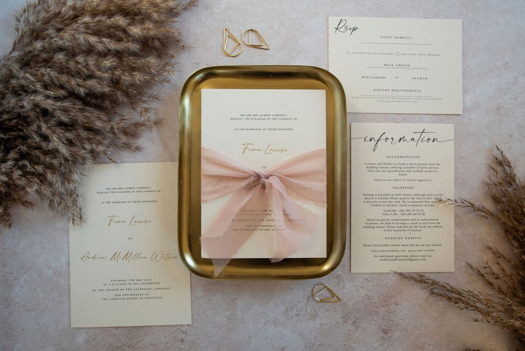 luxury hot foil invitation on cream card stock with gold foil and silk ribbon 