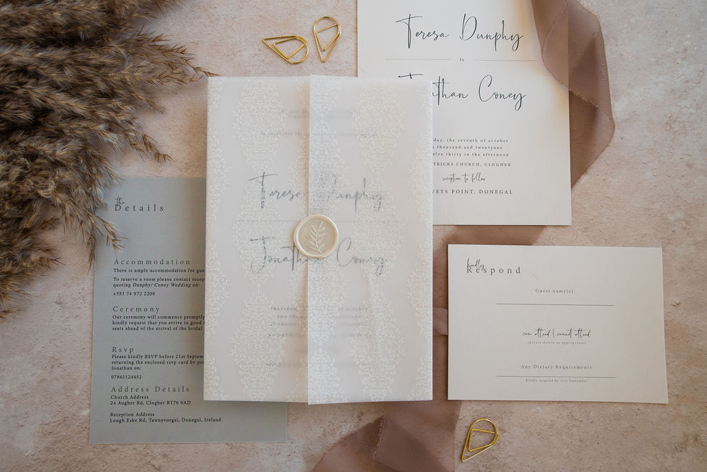 Timeless wedding invitation featuring printed vellum jacket and wax seal
